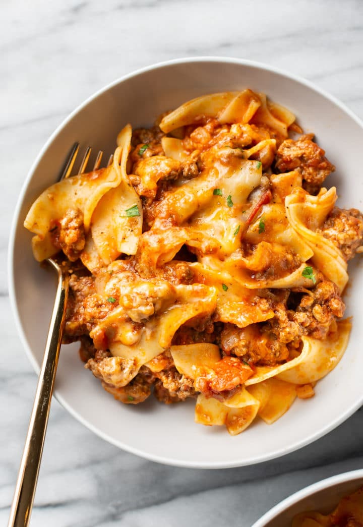 beef noodle casserole in a white bowl