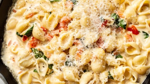 close-up of creamy tomato basil pasta in a skillet