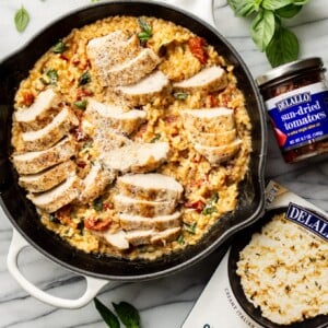 easy risotto skillet pictured with package of DeLallo's Quick Cook Risotto and jar of DeLallo sun-dried tomatoes