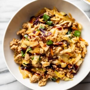 egg roll in a bowl in two white bowls