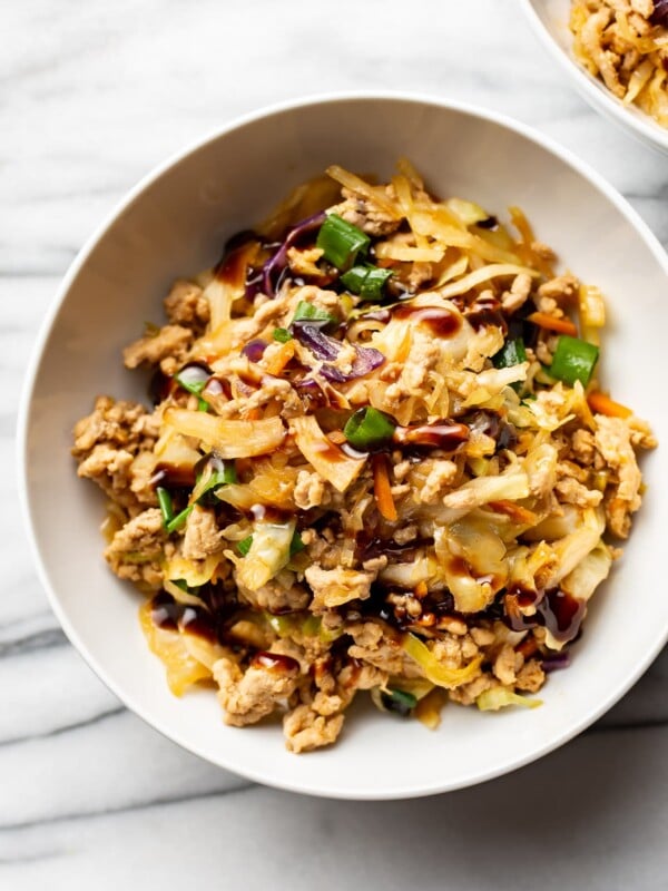 egg roll in a bowl in two white bowls