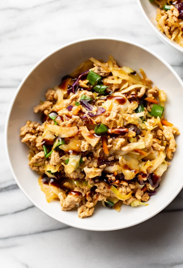 egg roll in a bowl in two white bowls