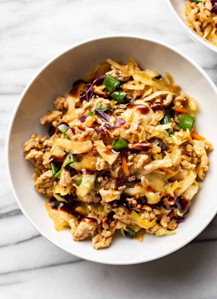 egg roll in a bowl in two white bowls