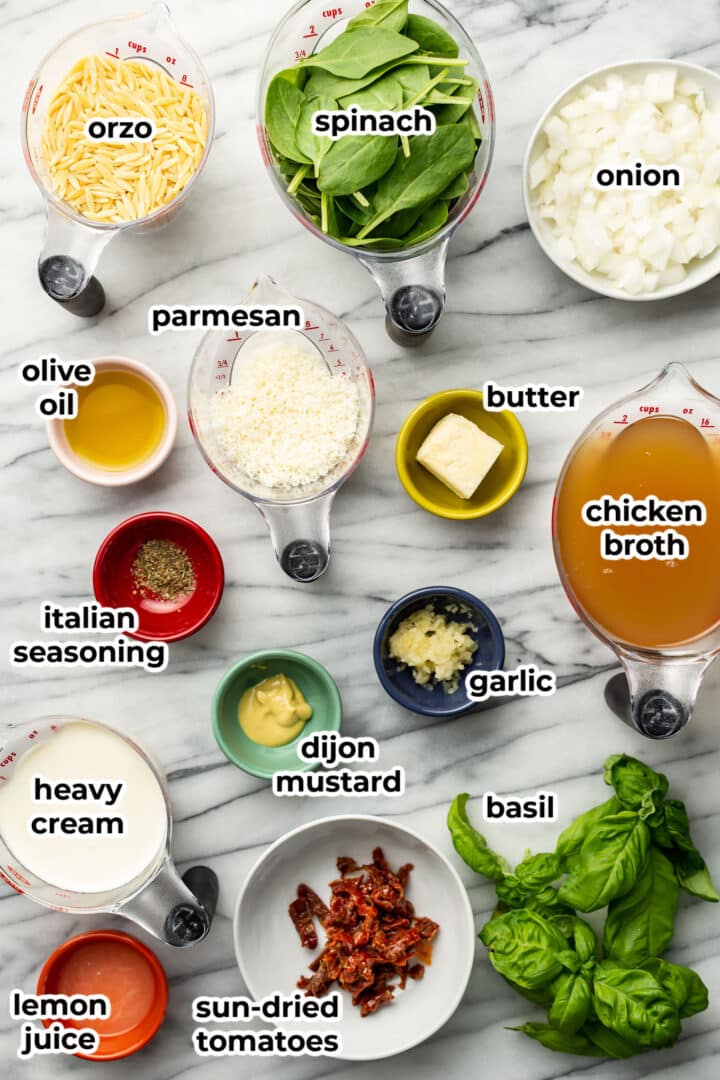 ingredients for creamy tuscan orzo in prep bowls