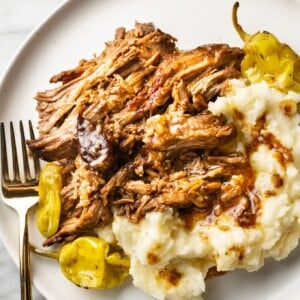 Mississippi pot roast on a plate with mashed potatoes