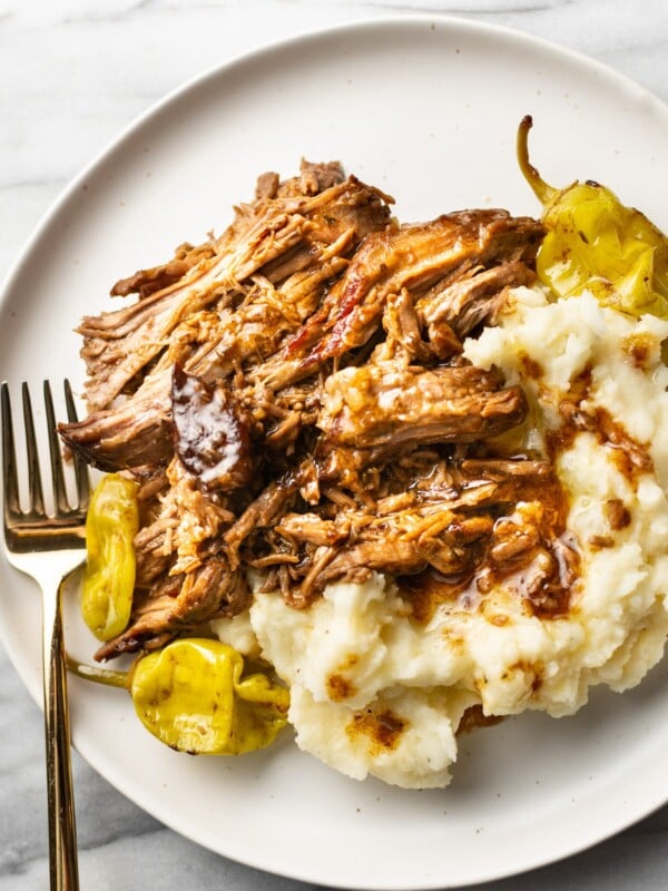 Mississippi pot roast on a plate with mashed potatoes