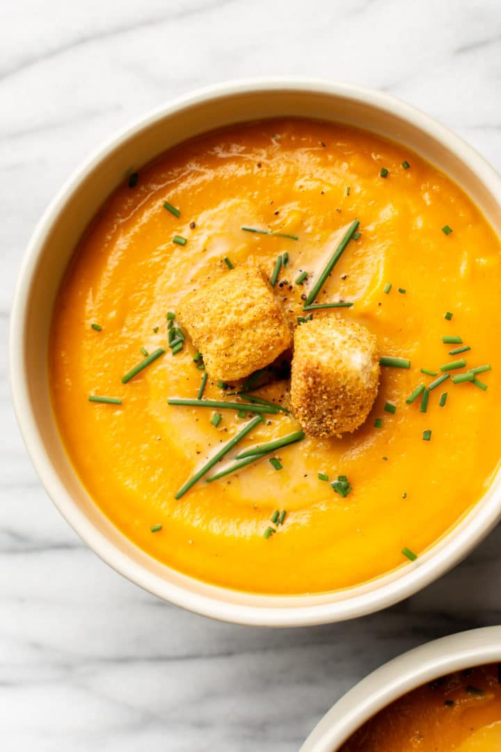 roasted vegetable soup in two bowls