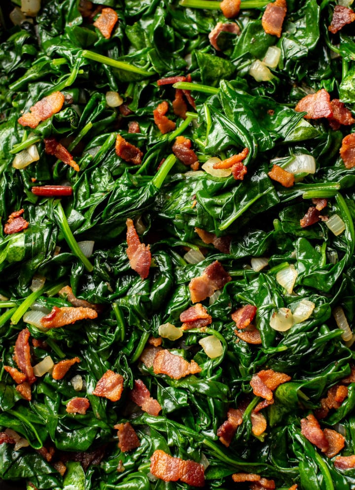 close-up of sauteed spinach with bacon