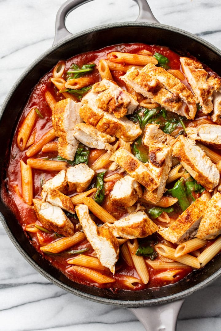 close-up of spicy chicken pasta in a skillet