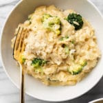 chicken broccoli and rice in two white bowls