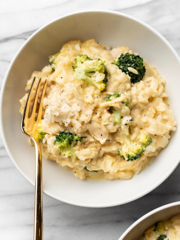 chicken broccoli and rice in two white bowls