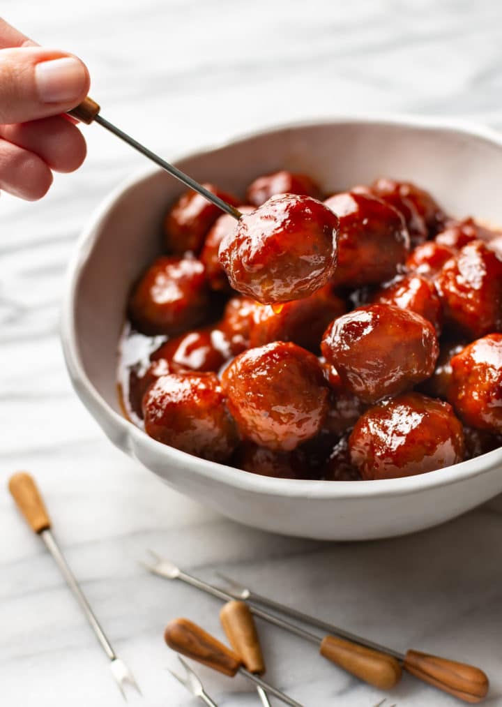 grape jelly meatballs in a white bowl