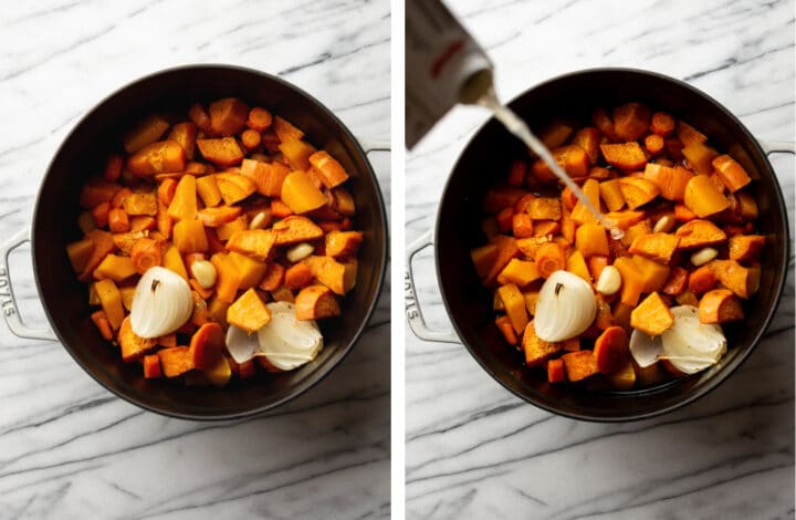 adding broth to roasted vegetables in a soup pot for fall vegetable soup