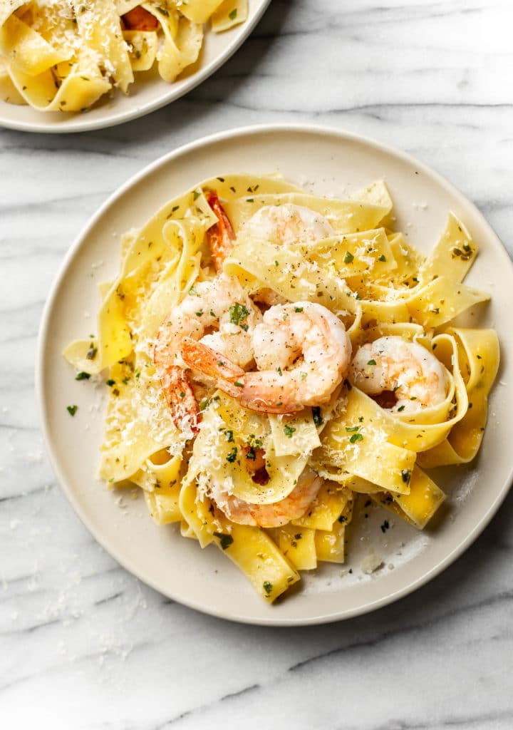 pappardelle with shrimp, olive oil, garlic, and lemon served on two plates