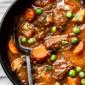 close-up of homemade beef stew in a bowl with a spoon