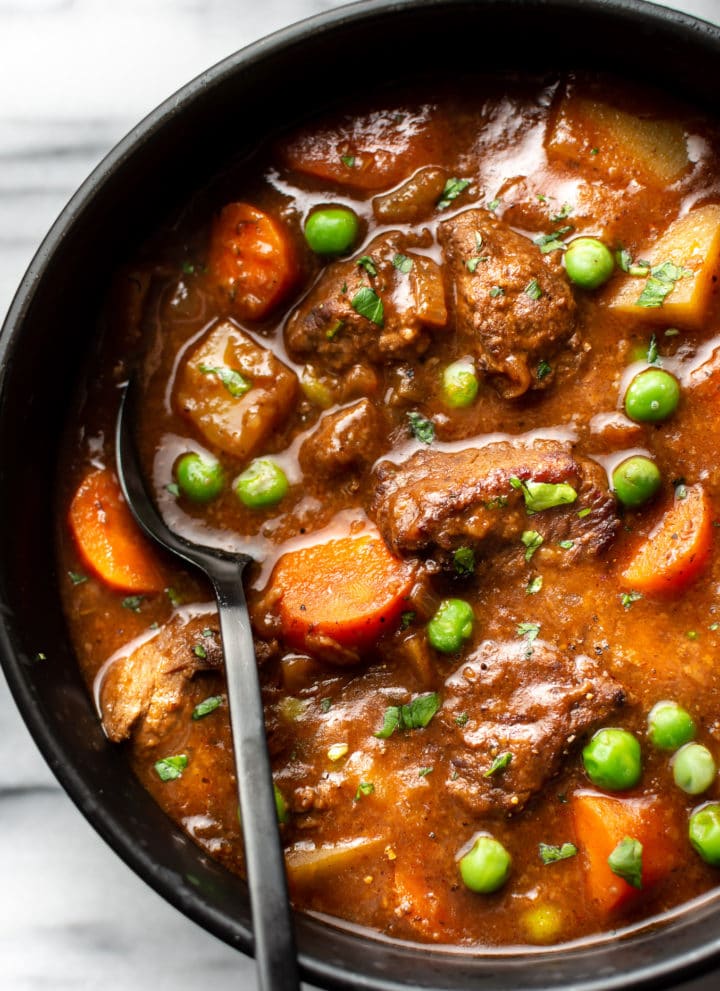 close-up of homemade beef stew in a bowl with a spoon