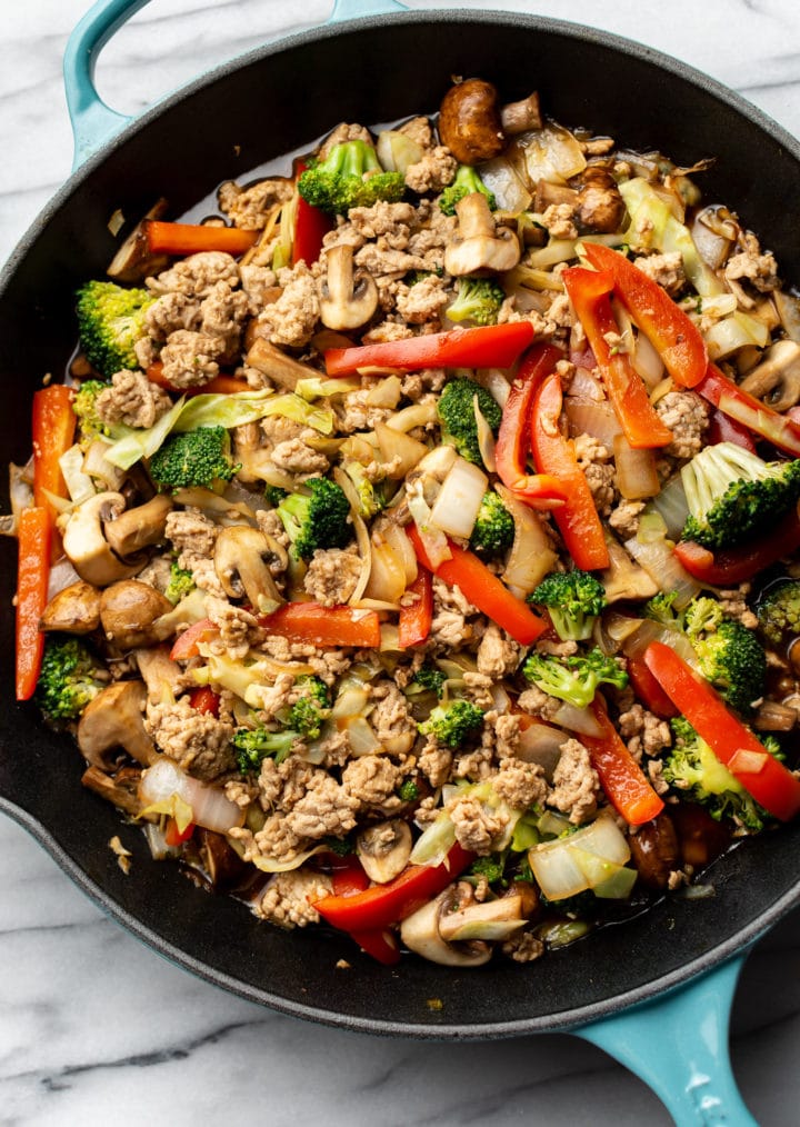 ground turkey stir fry in a cast iron skillet