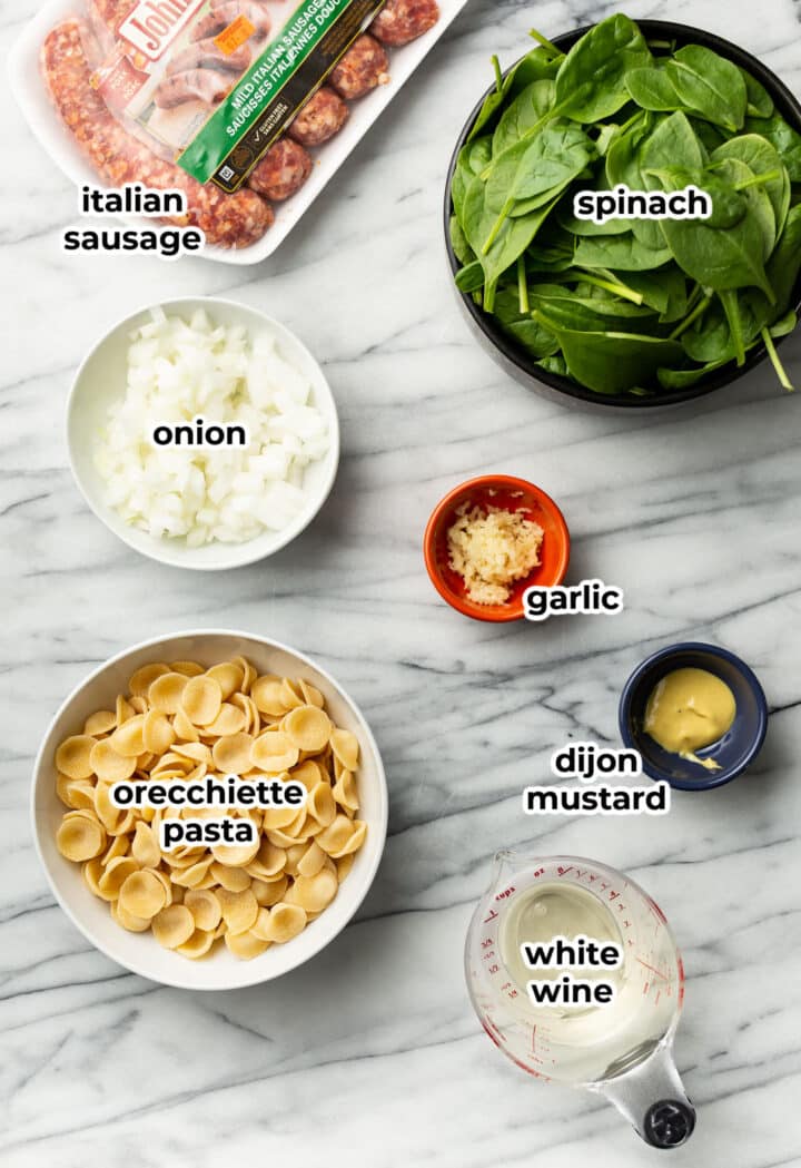 ingredients for orecchiette and sausage pasta in prep bowls