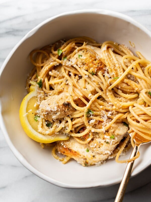 lemon pepper chicken pasta in a white bowl