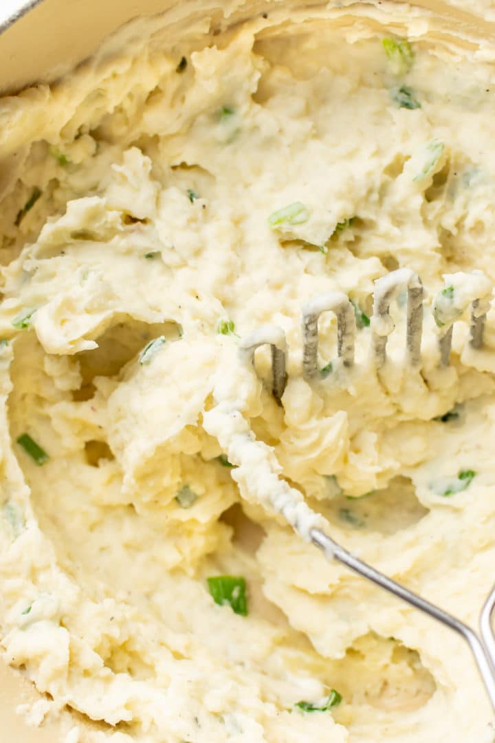 close-up of garlic mashed potatoes with sour cream