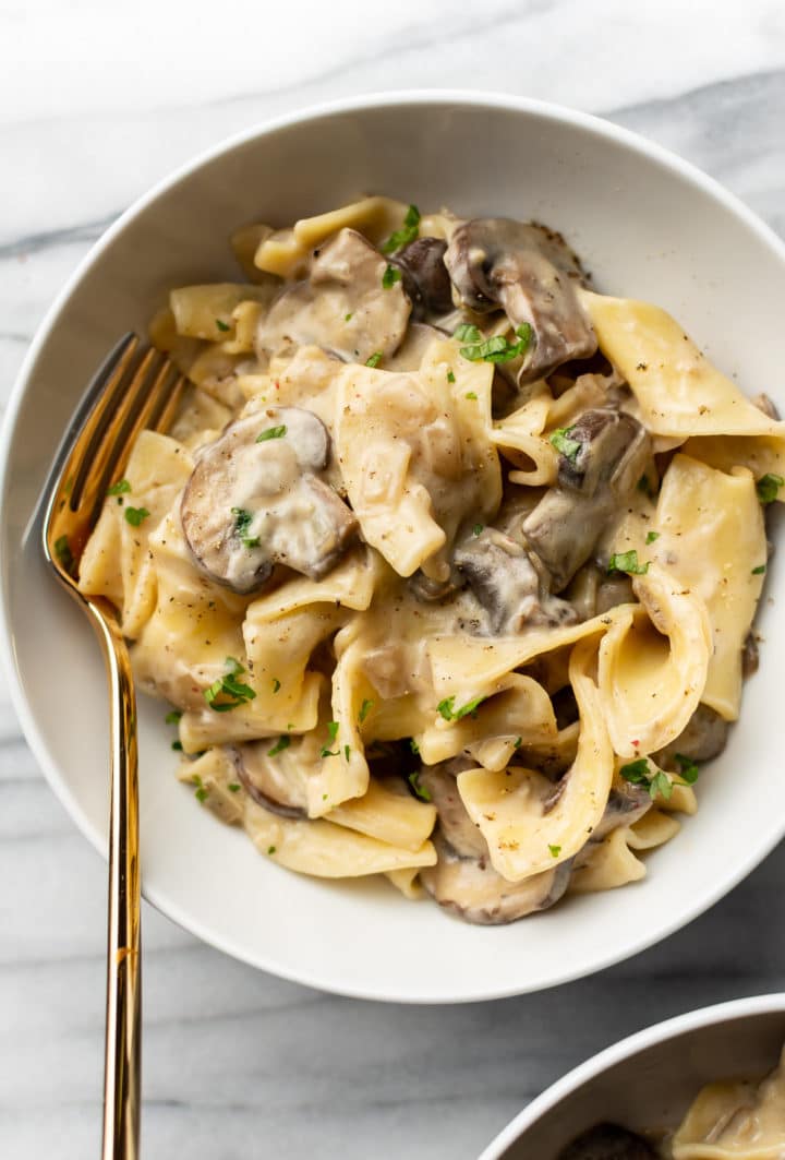 close-up of mushroom stroganoff in a white bowl