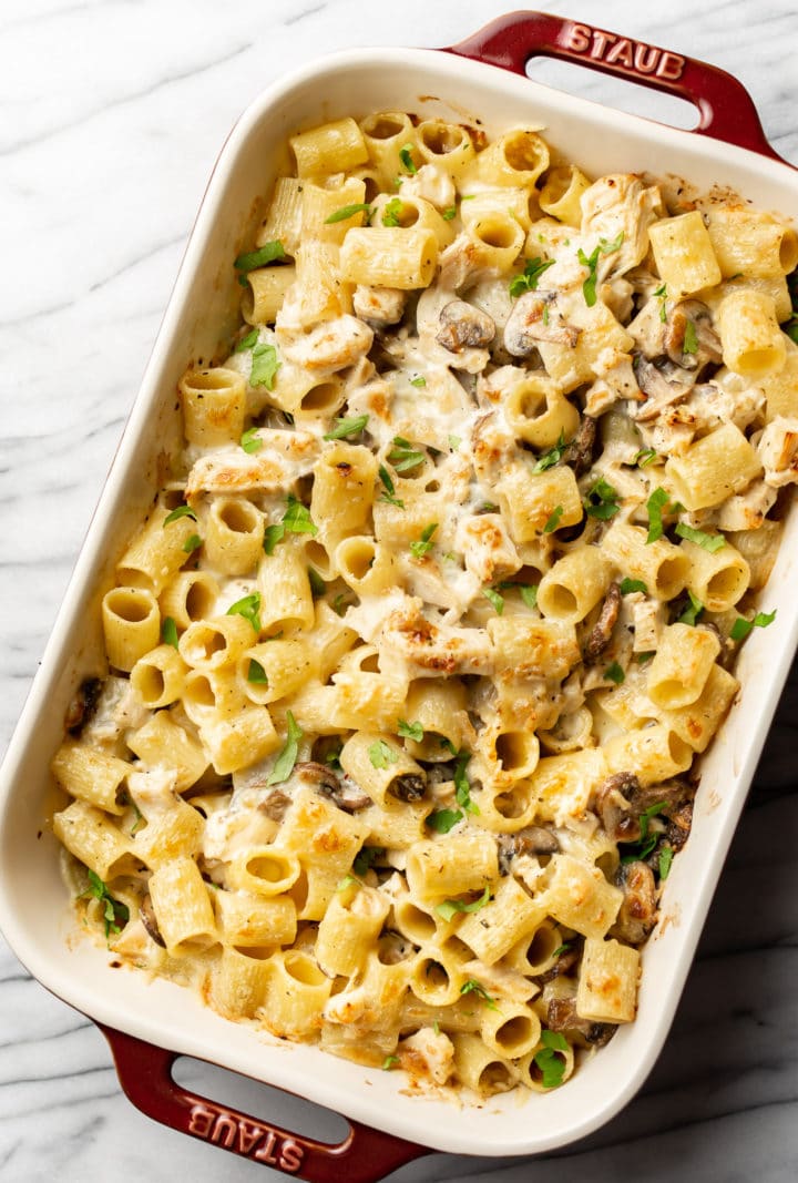 leftover turkey pasta bake in a Staub casserole dish