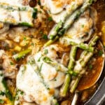 close-up of a skillet with chicken madeira and a serving spoon