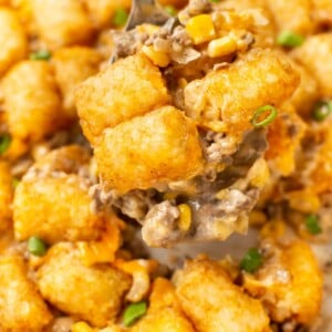 a spatula serving tater tot casserole