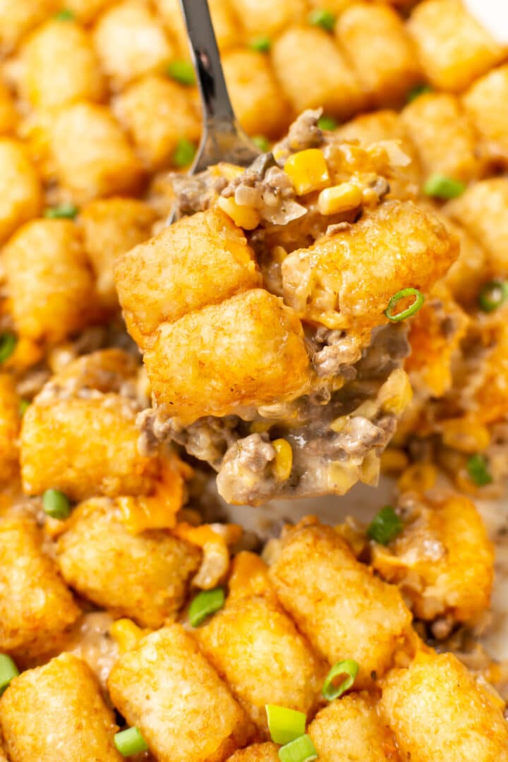 a spatula serving tater tot casserole