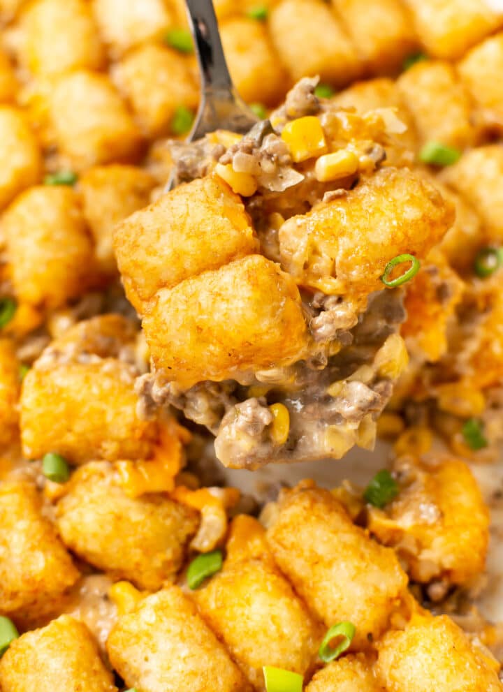 a spatula serving tater tot casserole