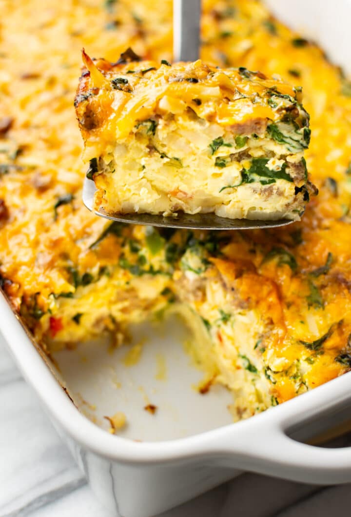 close up of a spatula with a slice of breakfast casserole