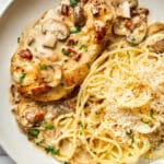 a plate with chicken riesling and buttered pasta