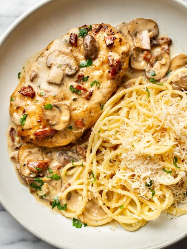 a plate with chicken riesling and buttered pasta