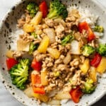 a bowl of ground pork stir fry over rice