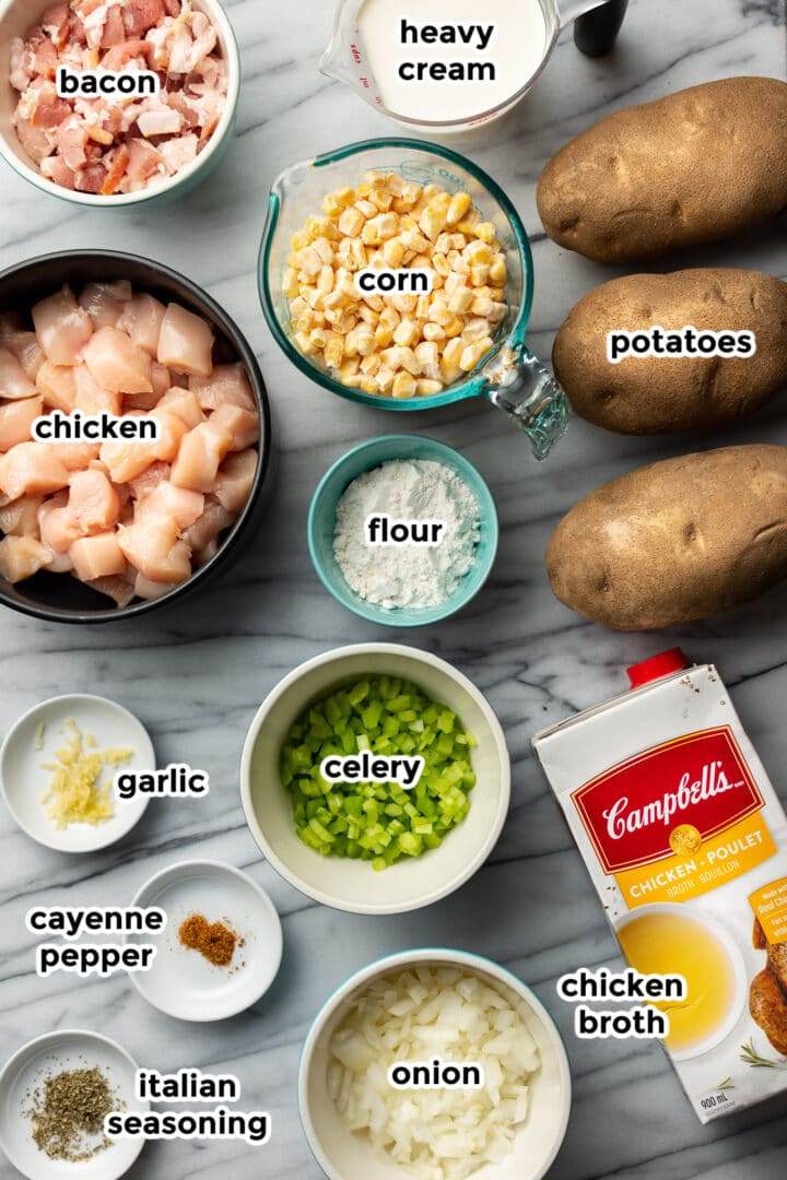 ingredients on a marble surface for chicken and corn chowder
