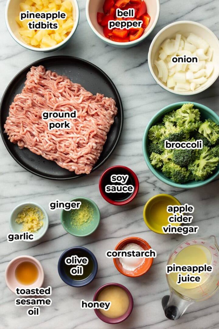 ingredients for ground pork stir fry on a marble surface