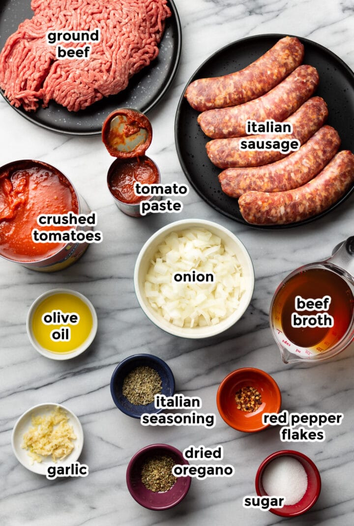 ingredients for meat sauce on a marble counter
