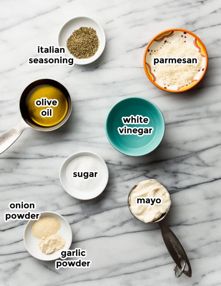 ingredients for olive garden salad on a marble surface