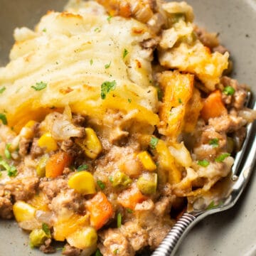 shepherd's pie on a plate with a fork
