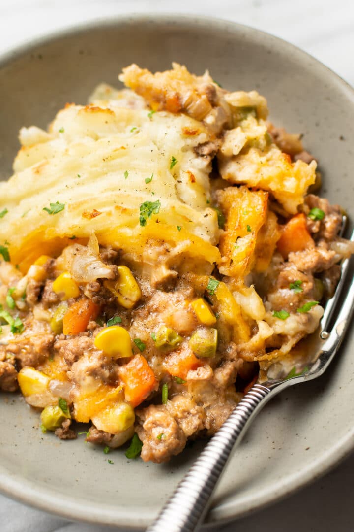 shepherd's pie on a plate with a fork