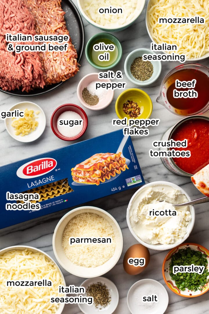 ingredients for homemade lasagna on a marble surface