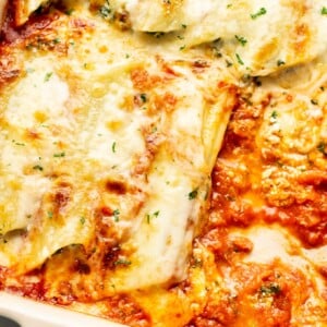 closeup of a baking dish with cheesy manicotti