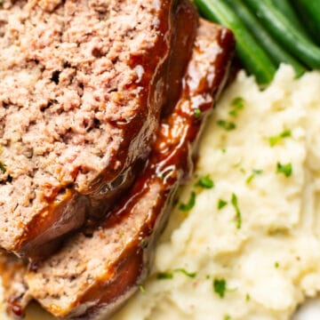closeup of meatloaf, green beans, and mashed potatoes