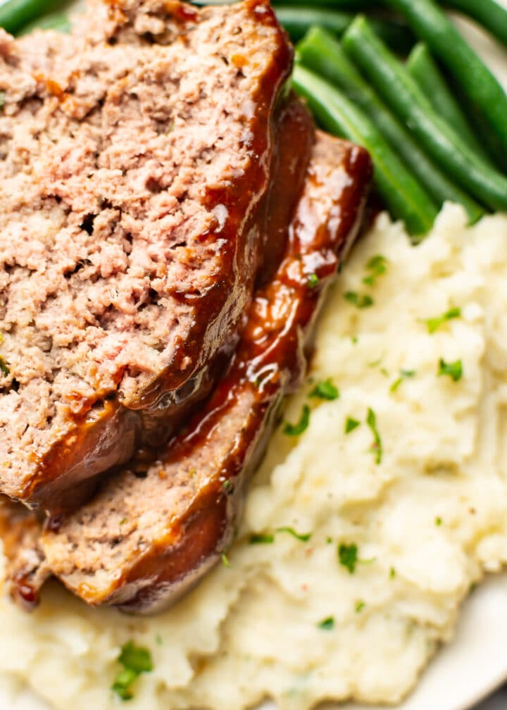 closeup of meatloaf, green beans, and mashed potatoes