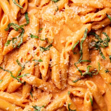 closeup of penne alla vodka with parmesan and basil