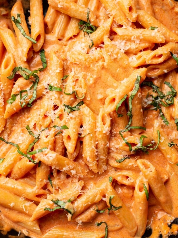 closeup of penne alla vodka with parmesan and basil