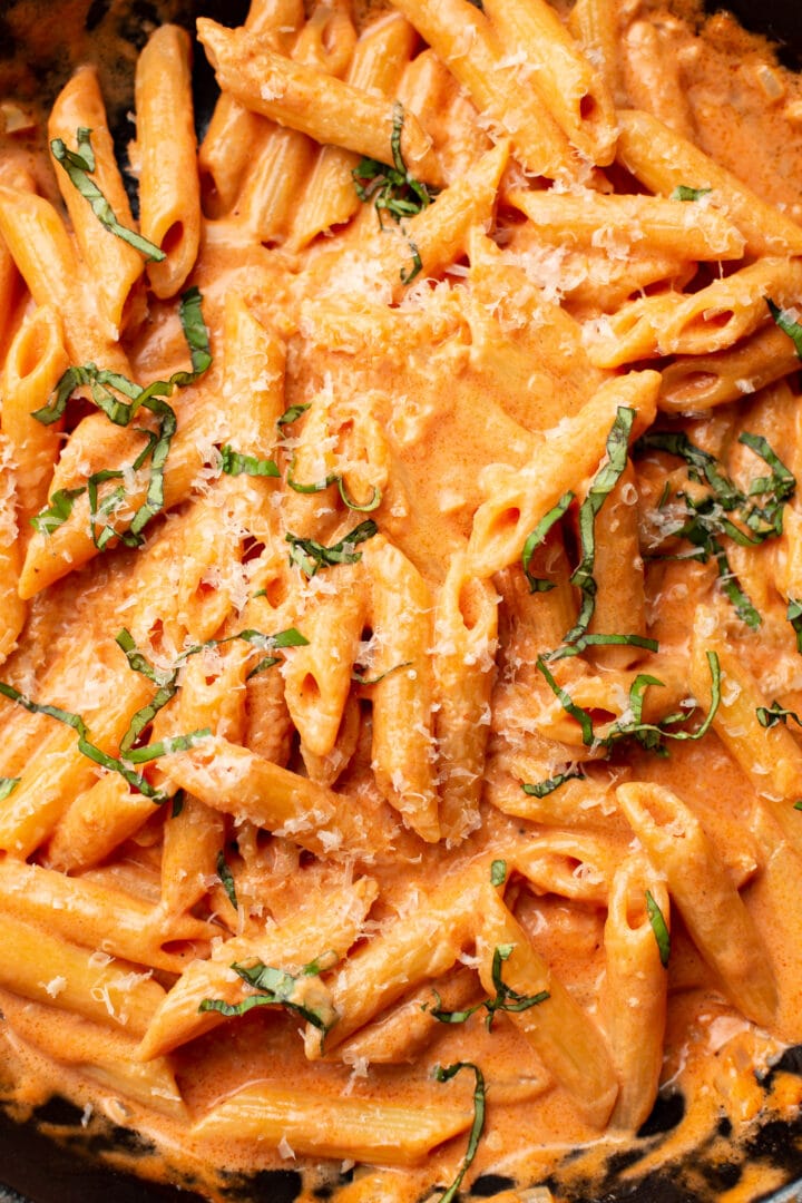 closeup of penne alla vodka with parmesan and basil