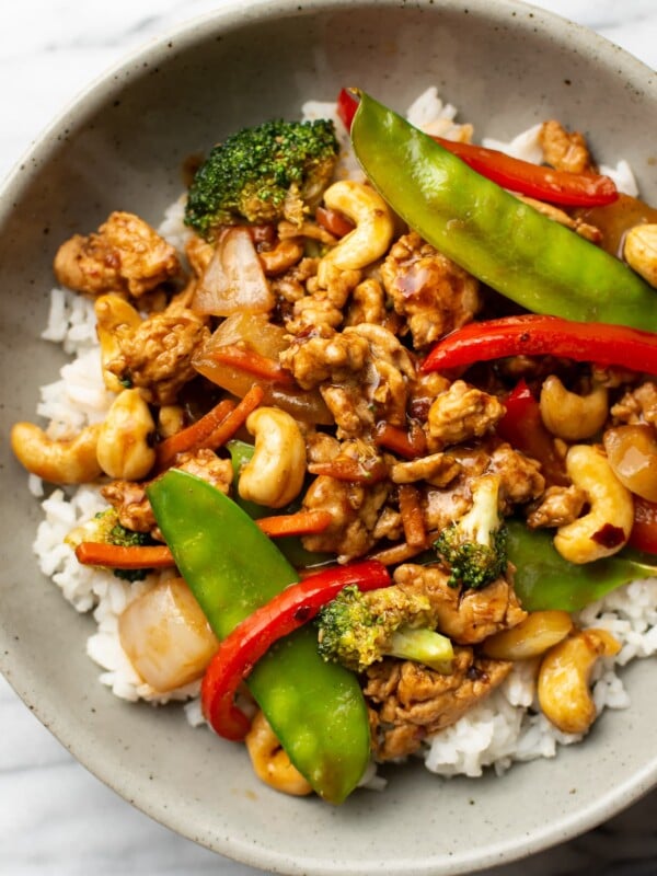 a bowl of ground chicken stir fry over jasmine rice