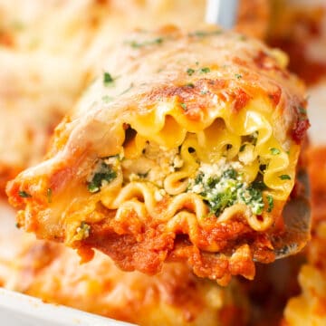 a spatula with a portion of lasagna rollups