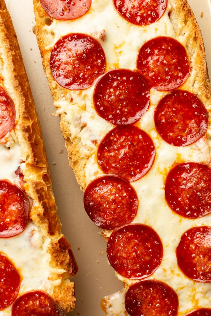 two halves of pepperoni french bread pizza